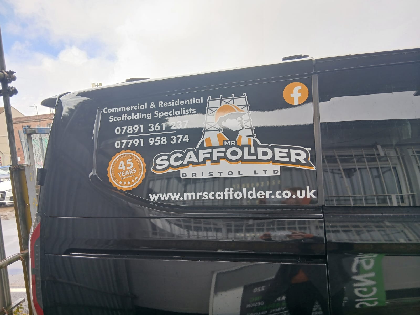 Black van rear door with Mr Scaffolder Bristol Ltd van graphics — orange and white vinyl lettering with 45 years experience badge, by Deco Studio
